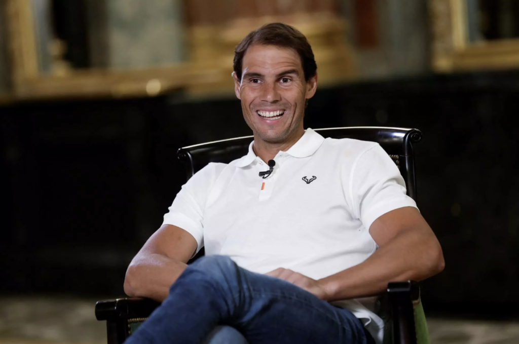 Rafael Nadal smiles relaxed in a chair